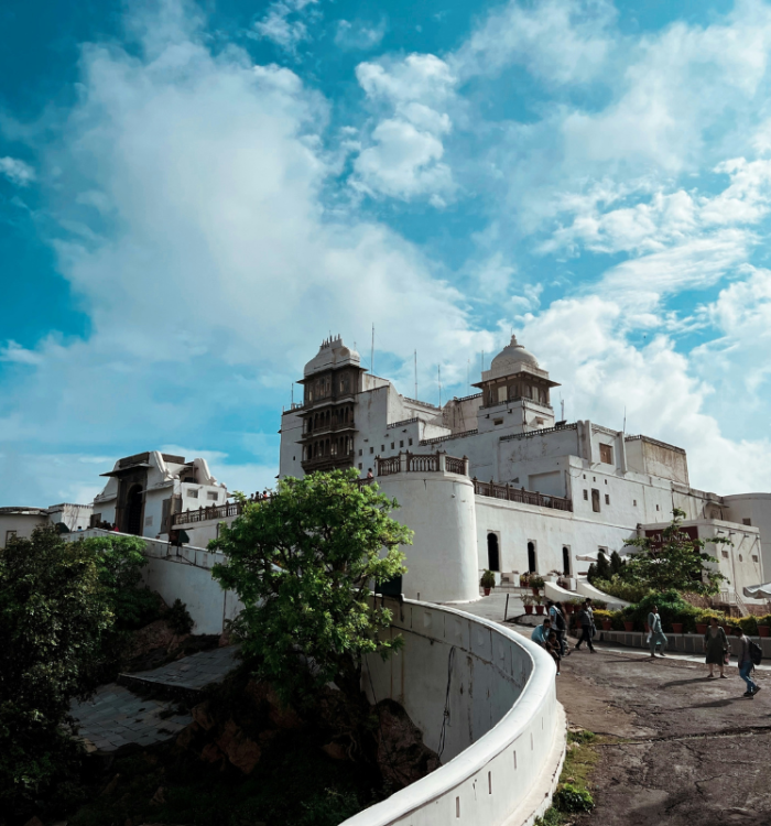The white Monsoon Palace perched on a hill overlooking Udaipur lakes