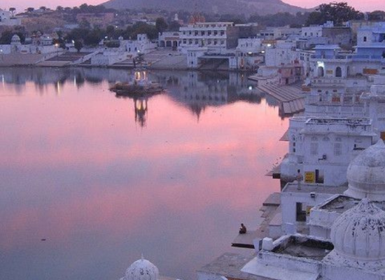 The holy Pushkar Lake surrounded by 52 bathing ghats and white temples