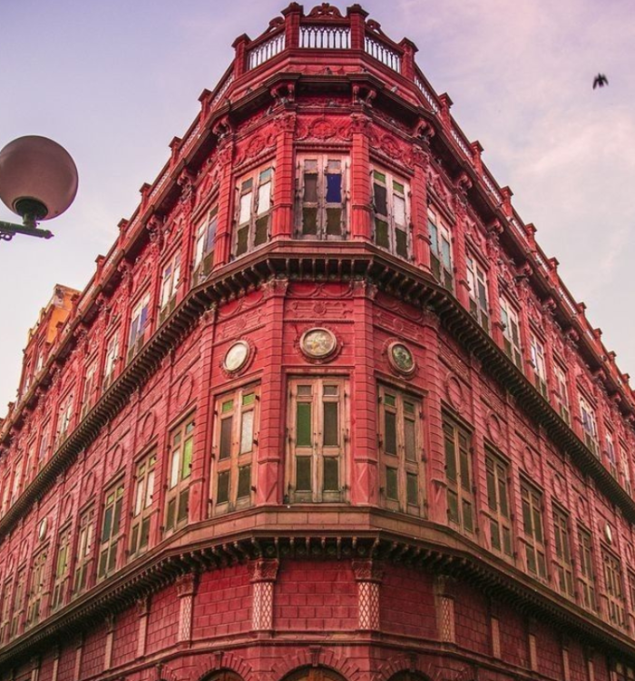 Intricate red sandstone carvings on the facade of Rampuria Haveli in Bikaner